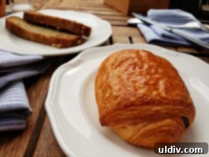 Etta A Taste of Hearth Magic 25 A close-up of the delicious chocolate croissant, showcasing its flaky layers and rich chocolate filling.