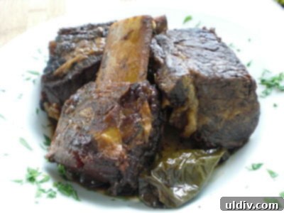 Tender Slow Cooker Korean Short Ribs 3 Tender Korean short ribs served with rice and broccoli.