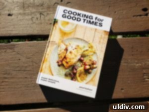 Find Your 2019 Holiday Gifts Spices Wines Books Coffee 11 Open cookbook, 'Cooking for Good Times' by Paul Kahan, showcasing a recipe