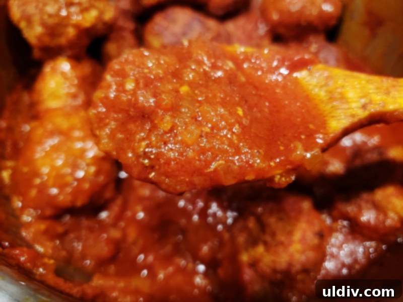 Experience True Freshness: European Canned Tomatoes for Exceptional Cooking 20 Meatballs simmering in rich tomato sauce