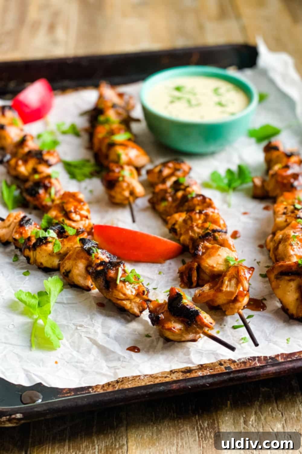 Honey-Glazed Cider Chicken Skewers with Sweet Mustard Sauce 3 Grilled chicken skewers arranged on a baking sheet, ready to serve