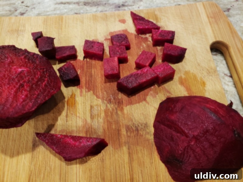 Super Bowl Vegan Snacks: Beetroot Appetizer & Plant-Based Game Day Recipes 3 Beetroot cubes tossed with olive oil, oregano, salt, and pepper, ready for roasting.