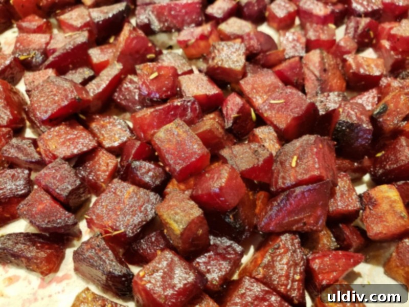 Super Bowl Vegan Snacks: Beetroot Appetizer & Plant-Based Game Day Recipes 6 Roasted beetroot cubes cooling in a bowl after being removed from the oven.