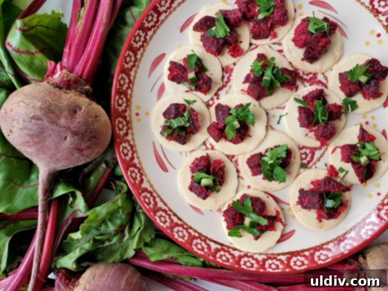 Super Bowl Vegan Snacks: Beetroot Appetizer & Plant-Based Game Day Recipes 7 Beetroot and horseradish salad served on a platter with crackers, garnished with fresh parsley.