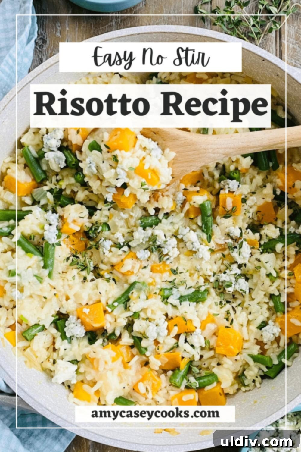 Creamy Butternut Squash Risotto 12 A wooden spoon holding a serving of creamy risotto with green beans, garnished with fresh herbs.