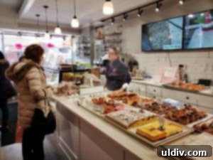 Chef Dobra Bielinski engaging with a customer in her bakery