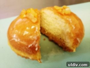 More Than Paczki: A Pastry Revelation 9 A close-up of a perfectly crafted paczki with candied orange peel