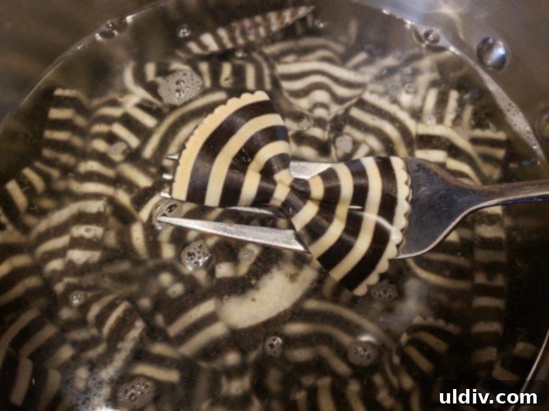 Squid Ink Pasta Salad The Best of Both Worlds 4 Gently sautéing cherry tomatoes and sugar snap peas