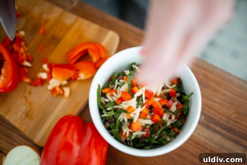 The Orzo and Dandelion Green Salad ingredients mixed
