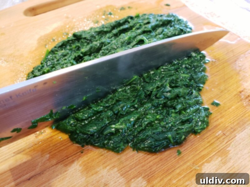 Fresh Greens For Spring Fuel Your Vibrant Life 5 Finely chopped spinach on a cutting board, ready for the purée