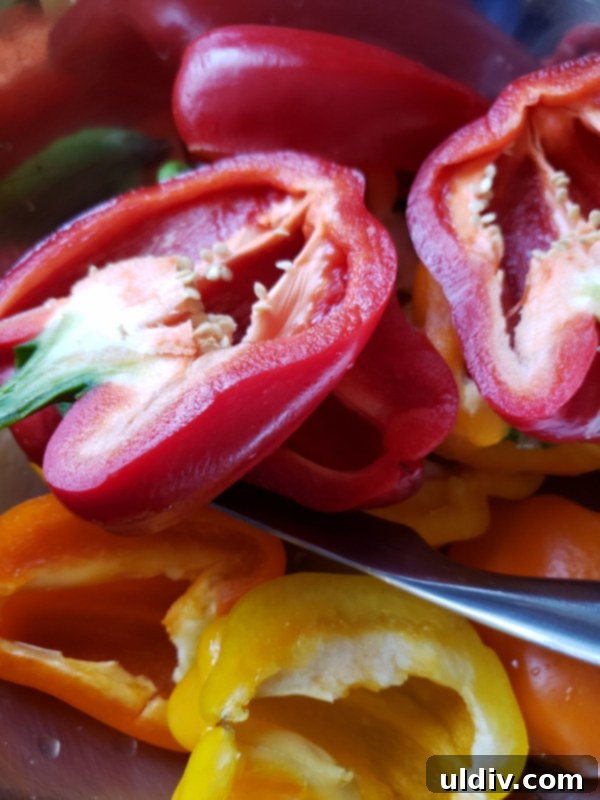Bell pepper halves with seeds visible before cleaning