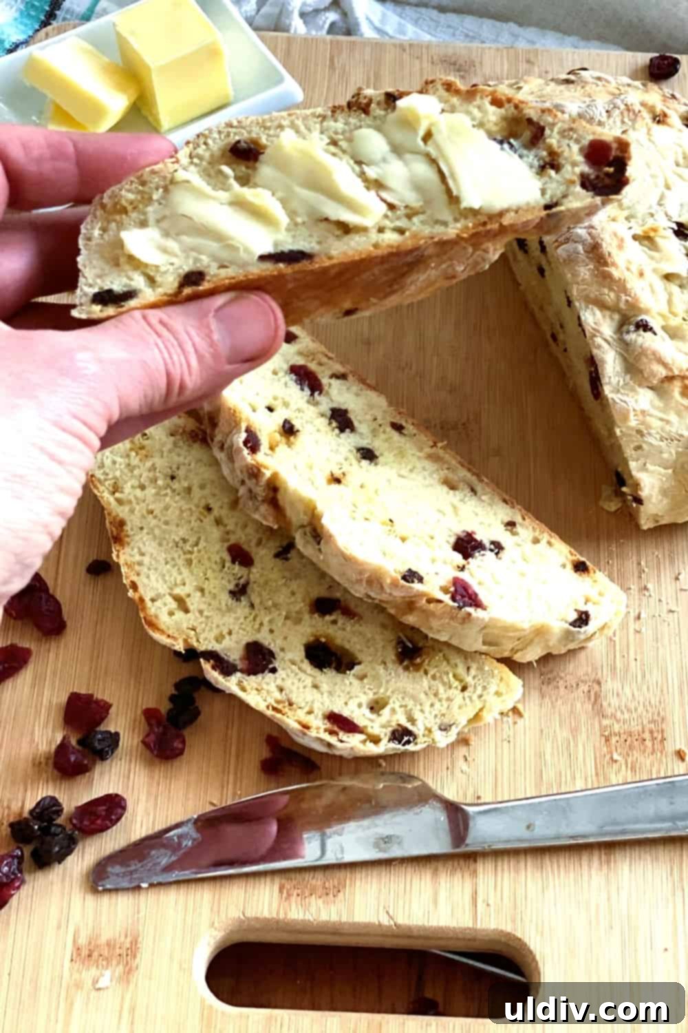 Ruby Berry Irish Soda Bread 5 A slice of soda bread with butter.