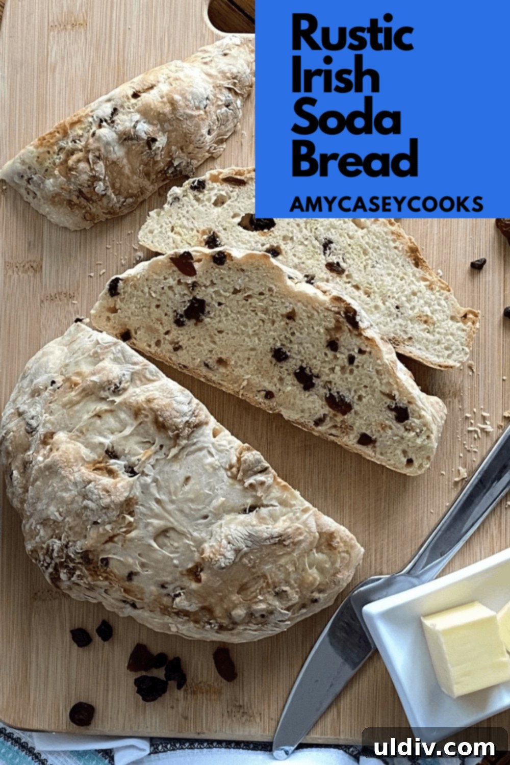 Ruby Berry Irish Soda Bread 7 Irish soda bread with 2 slices on a board.