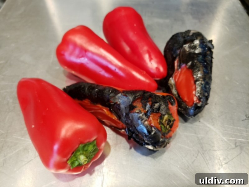 Mini peppers charring on an open flame