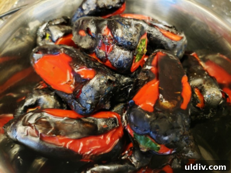 Roasted mini peppers cooling in a bowl