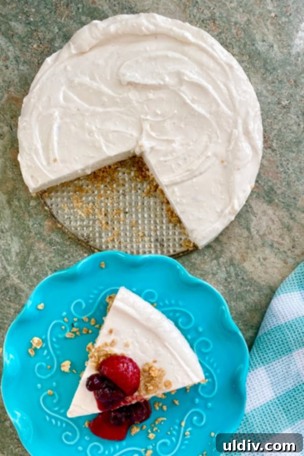 Easy No-Bake Strawberry Cheesecake with Vibrant Berry Drizzle 5 no bake cheesecake with 2 slices cut out