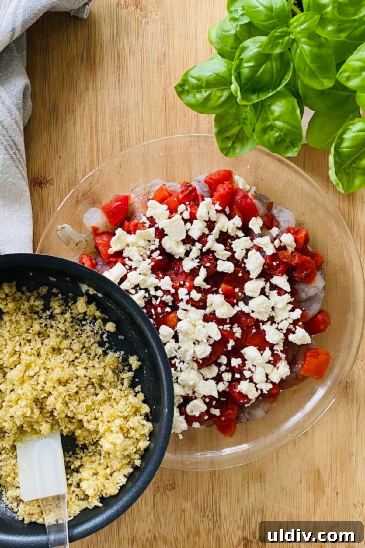 Mediterranean Feta Shrimp Bake 4 Topping a bed of shrimp, tomatoes, and feta with a generous layer of garlic butter panko breadcrumbs before baking.