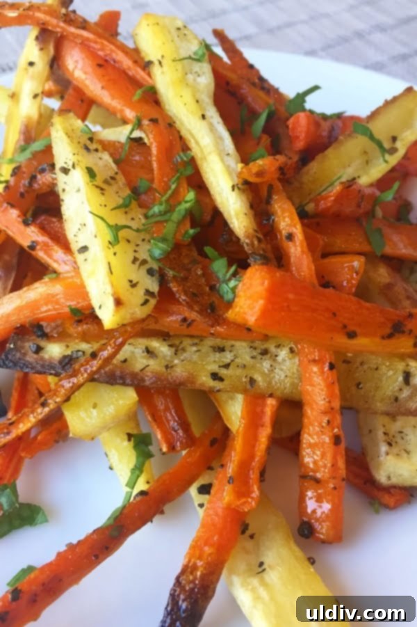 Plate of healthy roasted carrot and parsnip fries