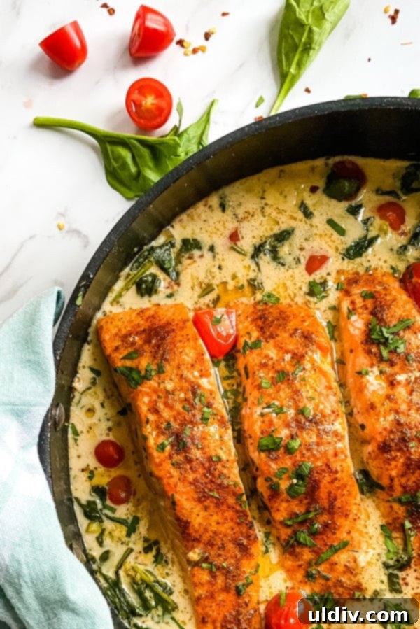 skillet with baked salmon in a coconut sauce - personal chef recipe