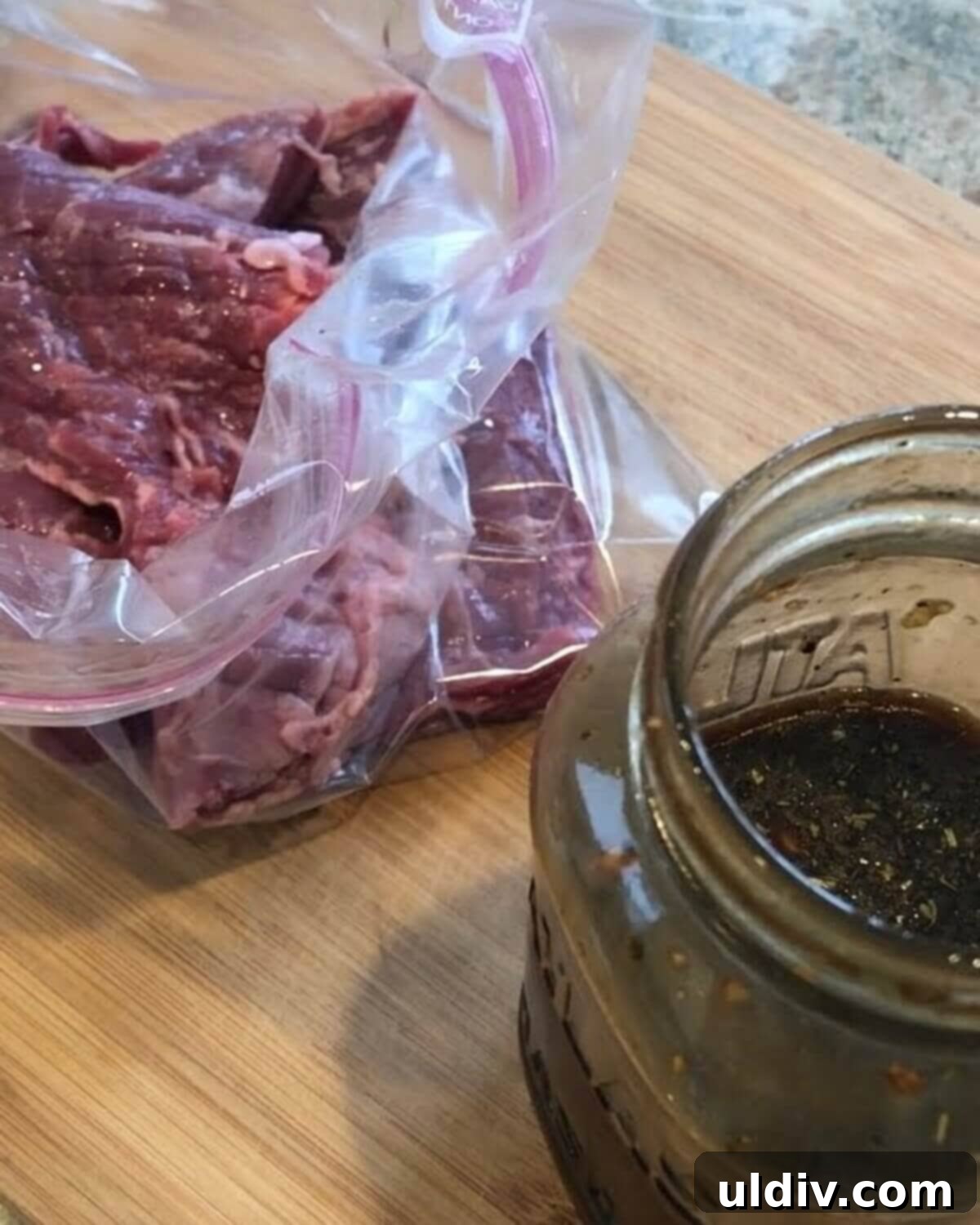 Blue Cheese Steak Salad with Balsamic Herbs 7 Skirt steak marinating in a resealable bag with balsamic herb vinaigrette, absorbing rich flavors before grilling.