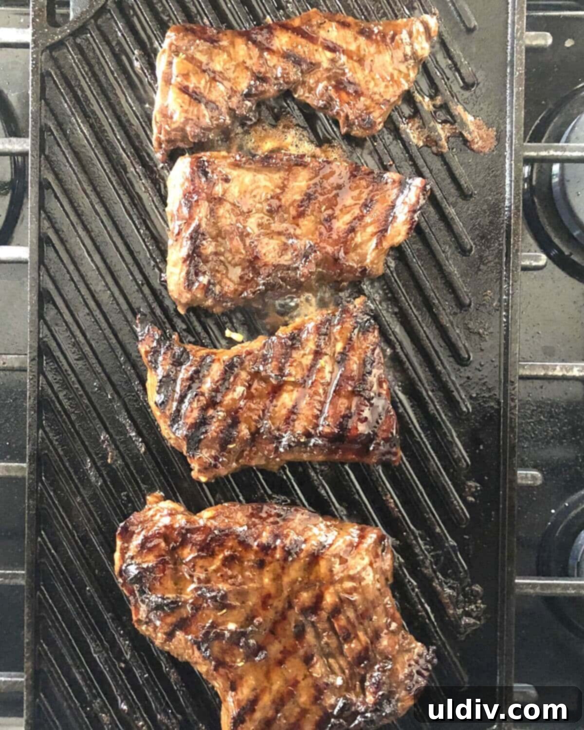 Balsamic Herb Grilled Steak Salad with Crumbled Blue Cheese 8 Skirt steak searing on a hot grill pan, developing a perfect crust.