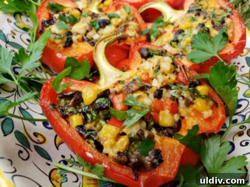 Cauliflower Mushroom Stuffed Peppers: Our Plant-Based Evolution 10 Close-up of a serving of cauliflower and mushroom stuffed bell pepper, garnished with fresh parsley