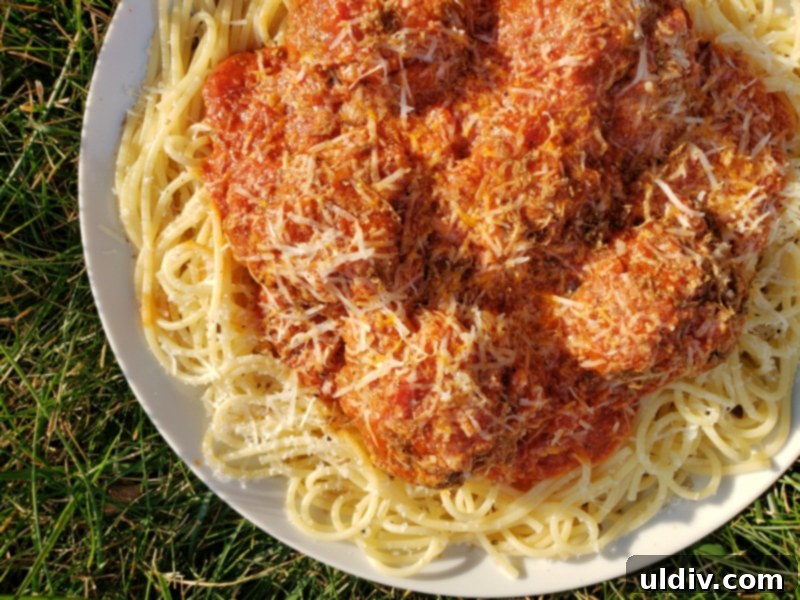 Truffle Shuffle's Fall Feast: A Virtual Celebration of Pasta, Meatballs, and Truffle Indulgence 20 A vibrant, finished spaghetti dish with a glass of red wine, inviting viewers to participate.