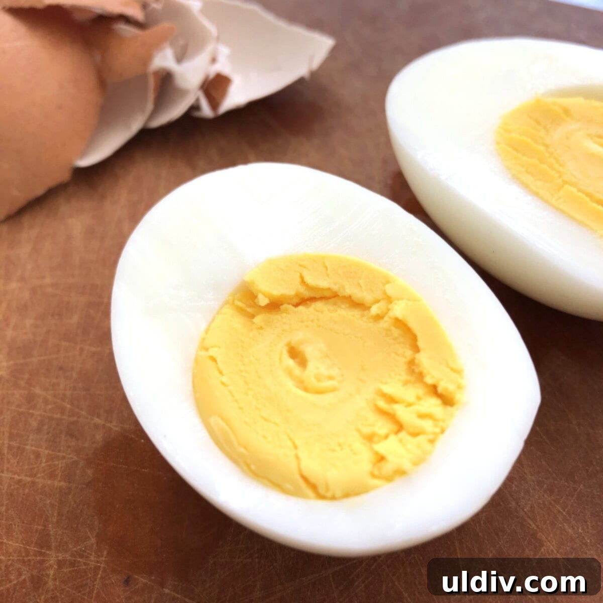 Pickle-Perfect Deviled Eggs 5 A sliced hard boiled egg.