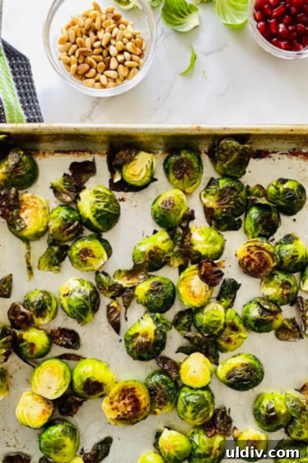 Honey Mustard Glazed Brussels Sprouts 4 roasted Brussels sprouts on a baking sheet with honey