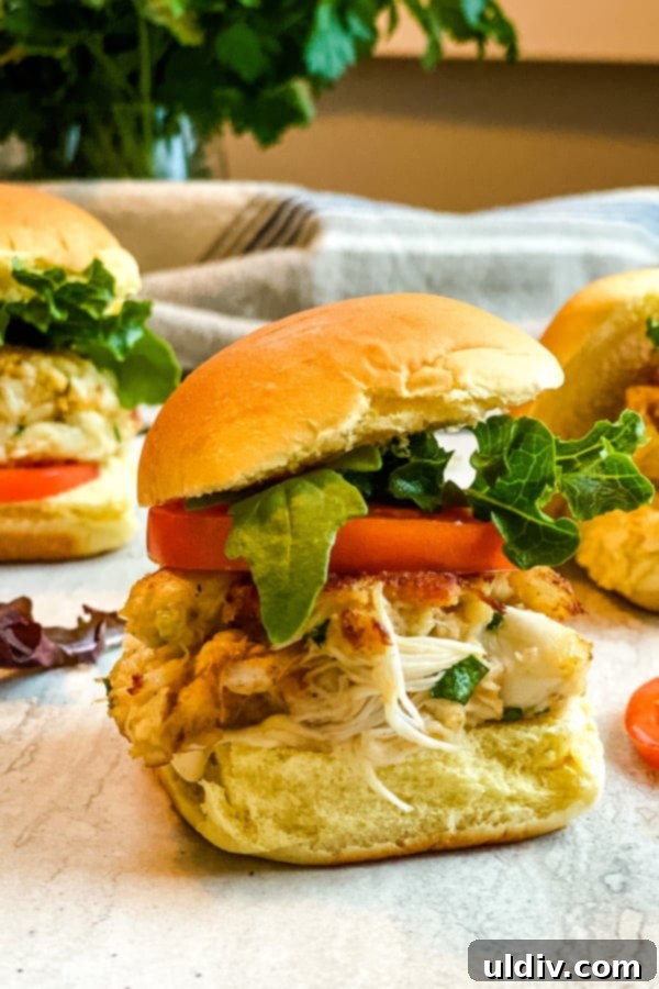 Crab Cake BLT Sliders 2 mini crab cake sandwiches with bacon, lettuce and tomato.