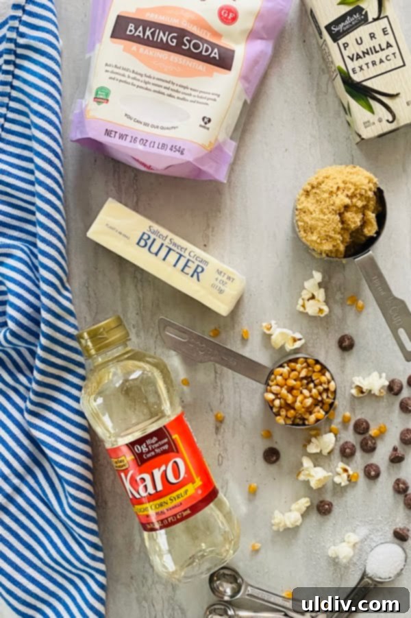 Irresistible Homemade Salted Caramel Popcorn 3 A simple yet inviting display of key ingredients for homemade caramel corn: a large bowl of fluffy popped popcorn, a bowl of rich light brown sugar, and a stick of golden salted butter, set against a rustic background.