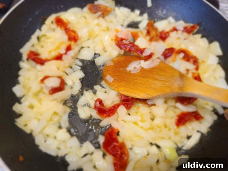 Çorbalarınızın Gizli Kahramanı: Lahana Turpu! 8 Diced onion and sun-dried tomatoes sautéing in a pan