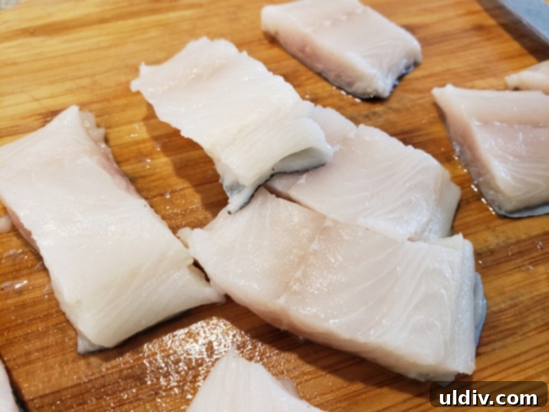 Autumn's Health Elixir: Dive Into Delicious Fish Soup 6 Close-up of fresh fish, likely Wild Alaskan Sablefish, ready for cooking.
