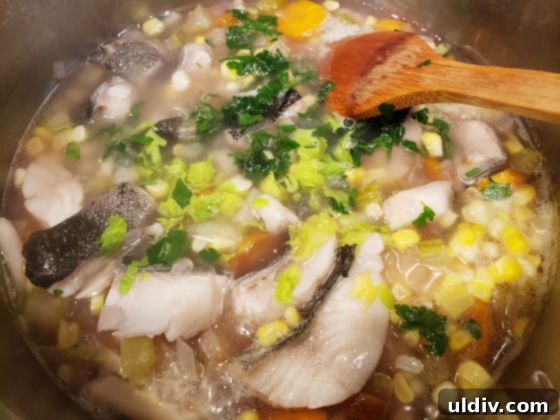 Autumn's Health Elixir: Dive Into Delicious Fish Soup 9 Fresh corn and parsley added to the nearly finished fish soup.