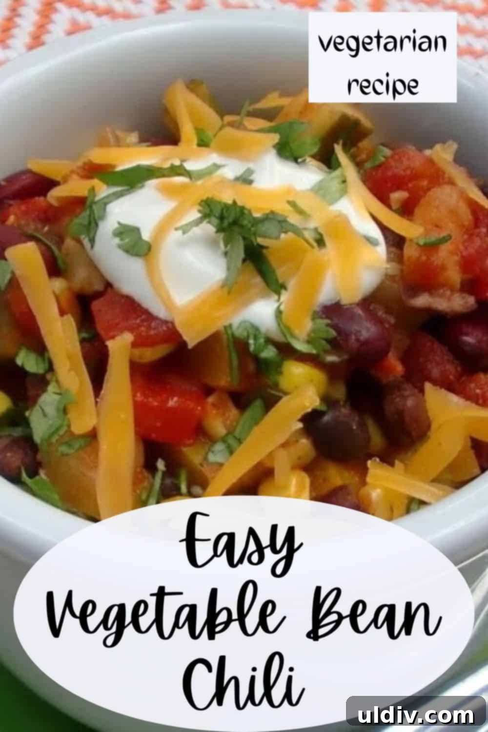 A beautifully presented bowl of vegetarian chili, ready to eat.