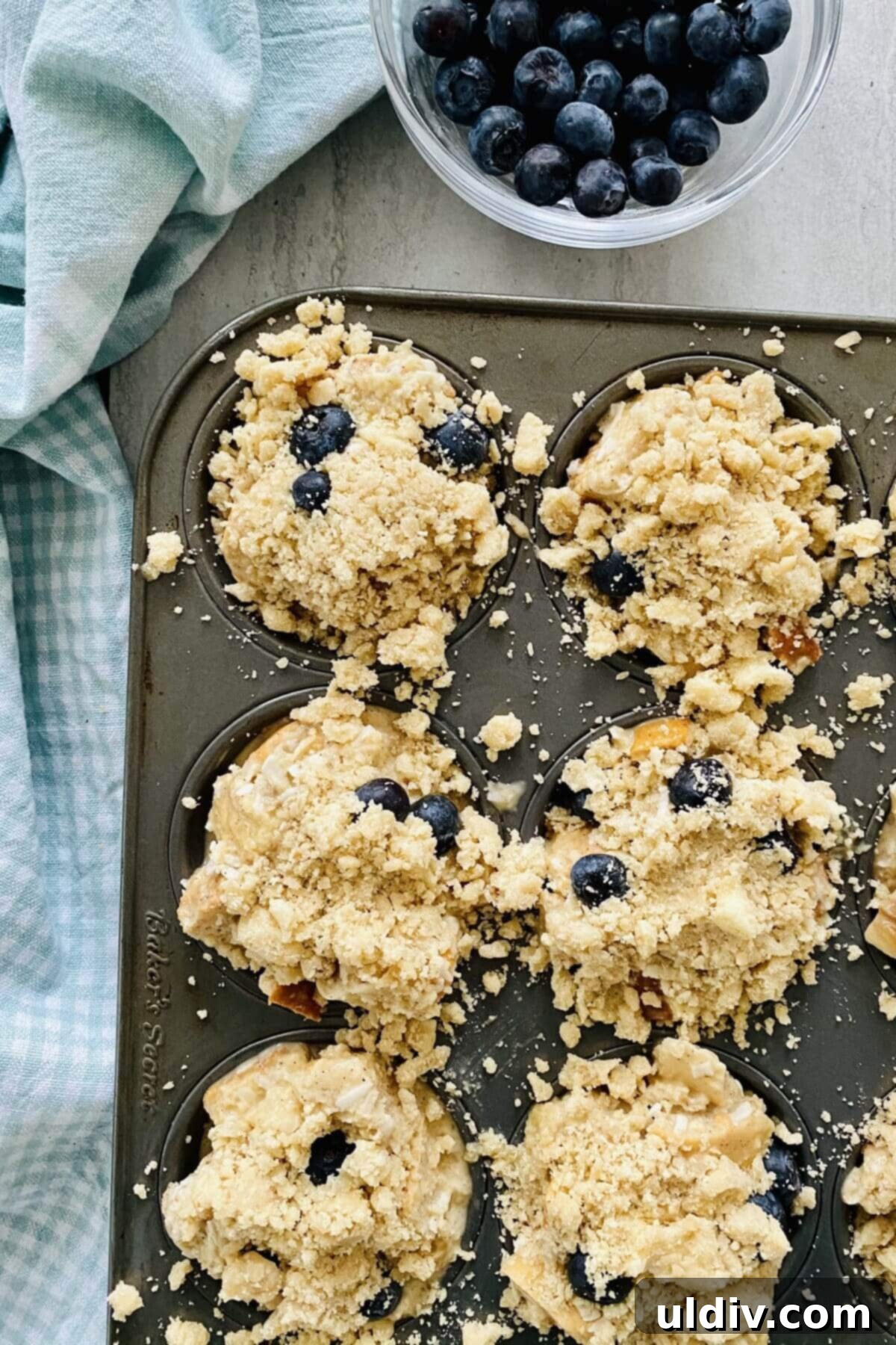 Blueberry Coconut Cinnamon French Toast Muffins 8 Close-up of a rich, buttery brown sugar streusel crumble, perfectly prepared to top the French toast muffins.