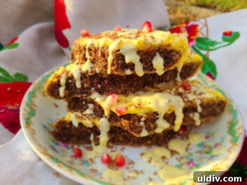 Close-up of the spongy, golden-brown topping of the cocoa cake, showing its unique texture.