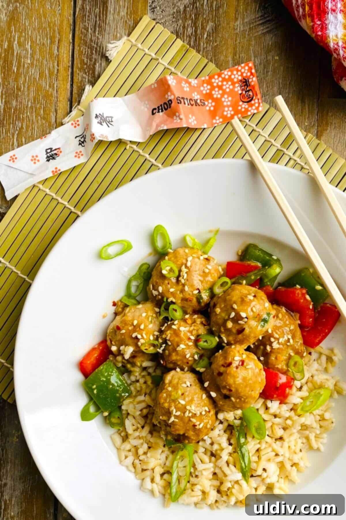 Quick 30-Minute Baked Teriyaki Glazed Turkey Meatballs 5 A serving of teriyaki turkey meatballs topped with sesame seeds in a bowl, ready to be enjoyed.