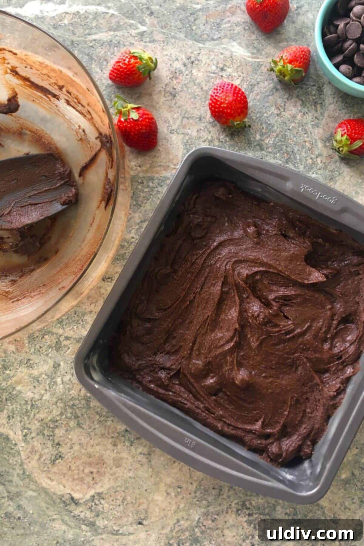 Your New Favorite One Bowl Fudgy Brownies 7 Brownie batter evenly spread in a metal baking pan, ready for the oven.