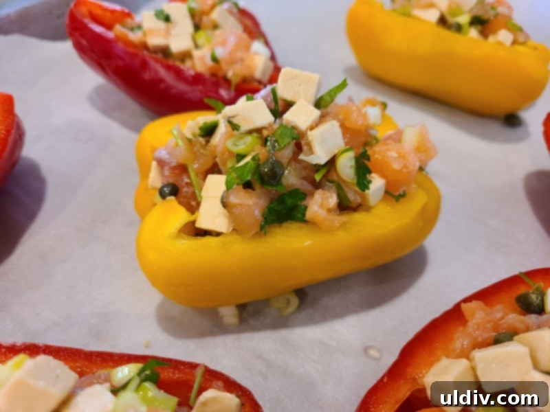 New Year's Kickoff Salmon and Gouda Stuffed Peppers 4 Stuffed peppers baking in the oven, aromas filling the kitchen