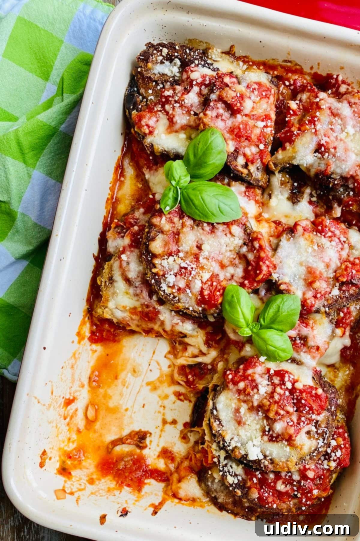 baked eggplant Parmesan with a piece missing
