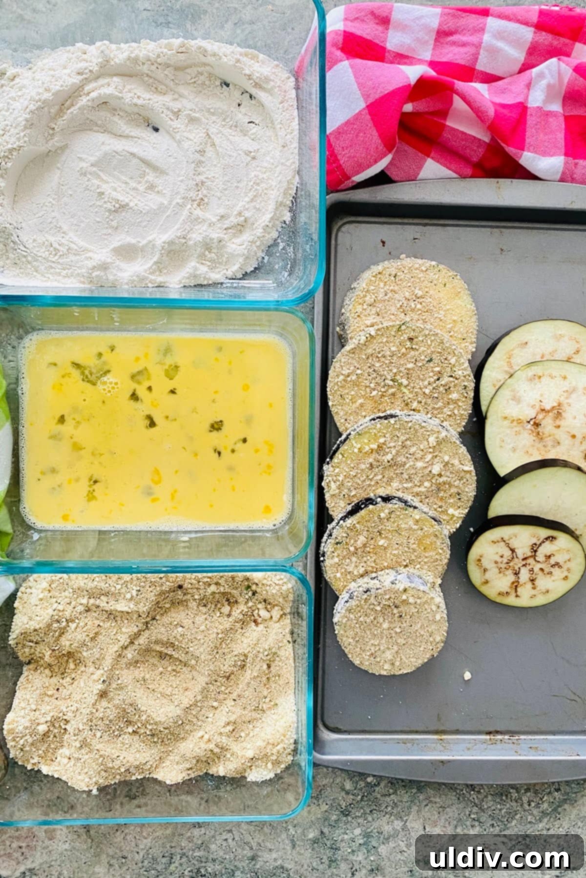 flour, eggs, breadcrumbs and eggplant slices