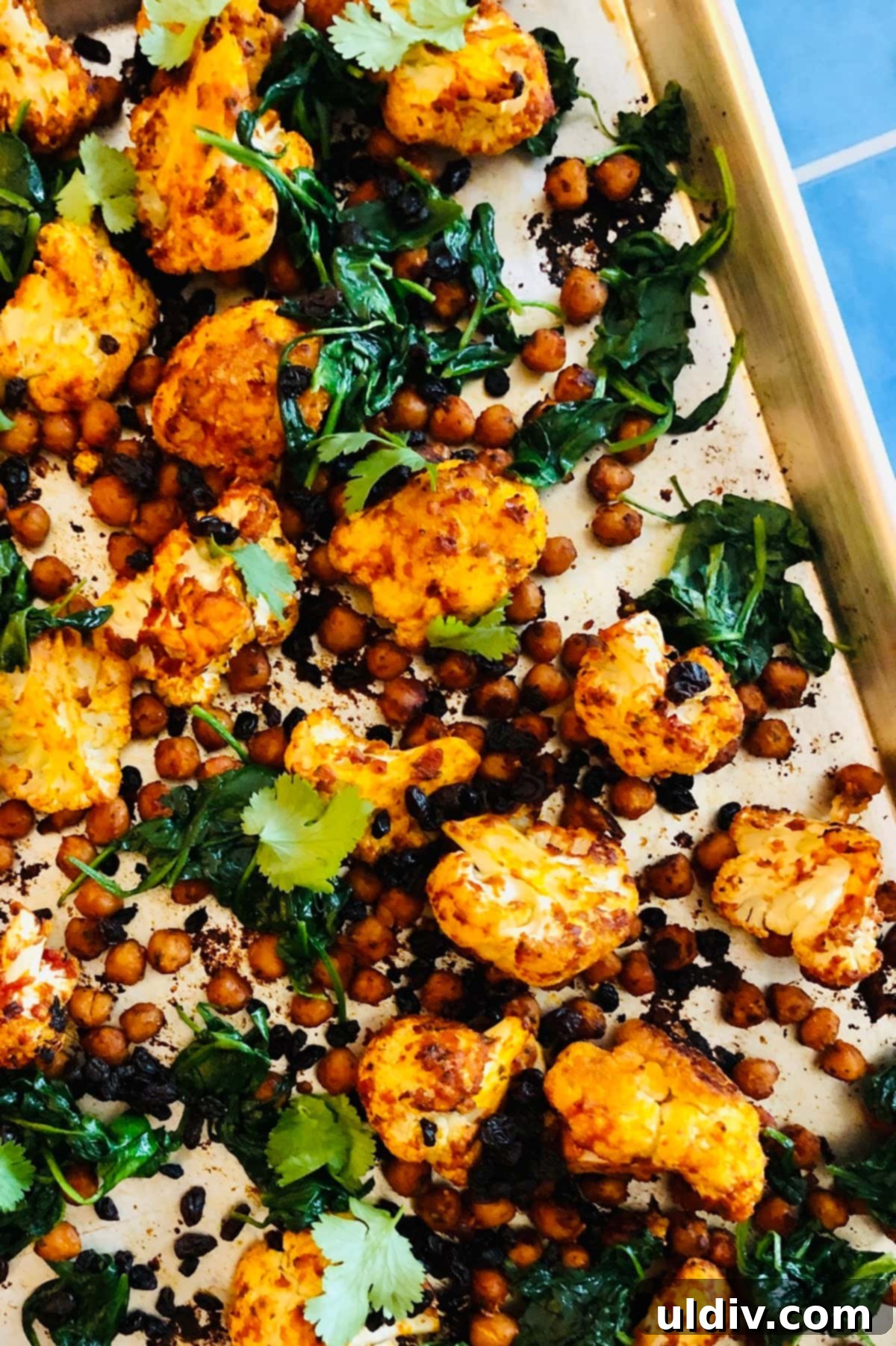 Spicy Harissa Power Bowl 5 sheet pan with roasted cauliflower, chickpeas and spinach with harissa