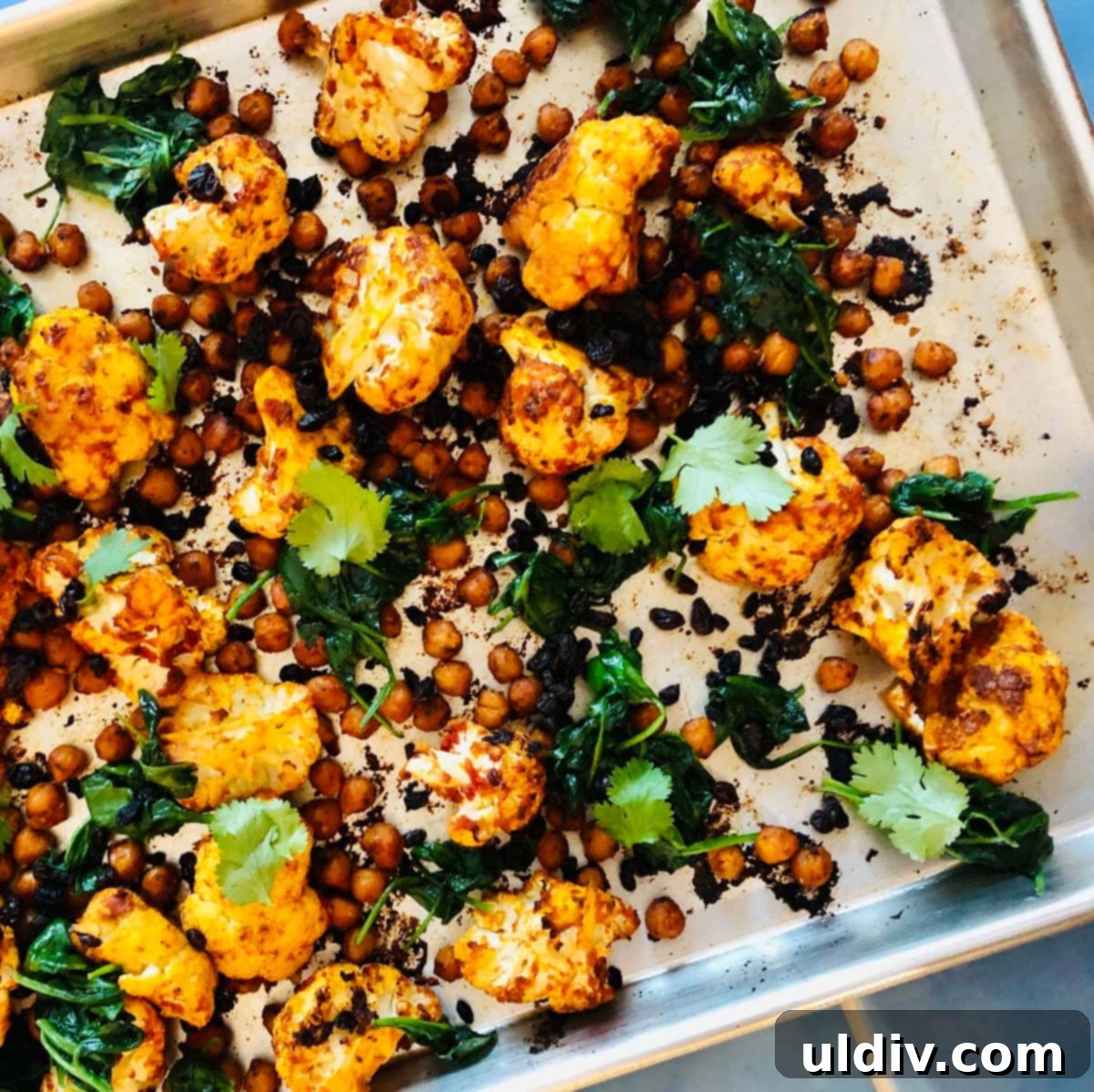 Harissa Fire-Roasted Cauliflower & Chickpea Medley 8 pan with roasted cauliflower and chickpeas