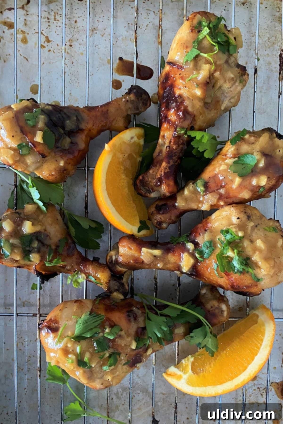 Golden Orange Dijon Roasted Chicken Legs 3 oven roasted chicken legs on a baking rack