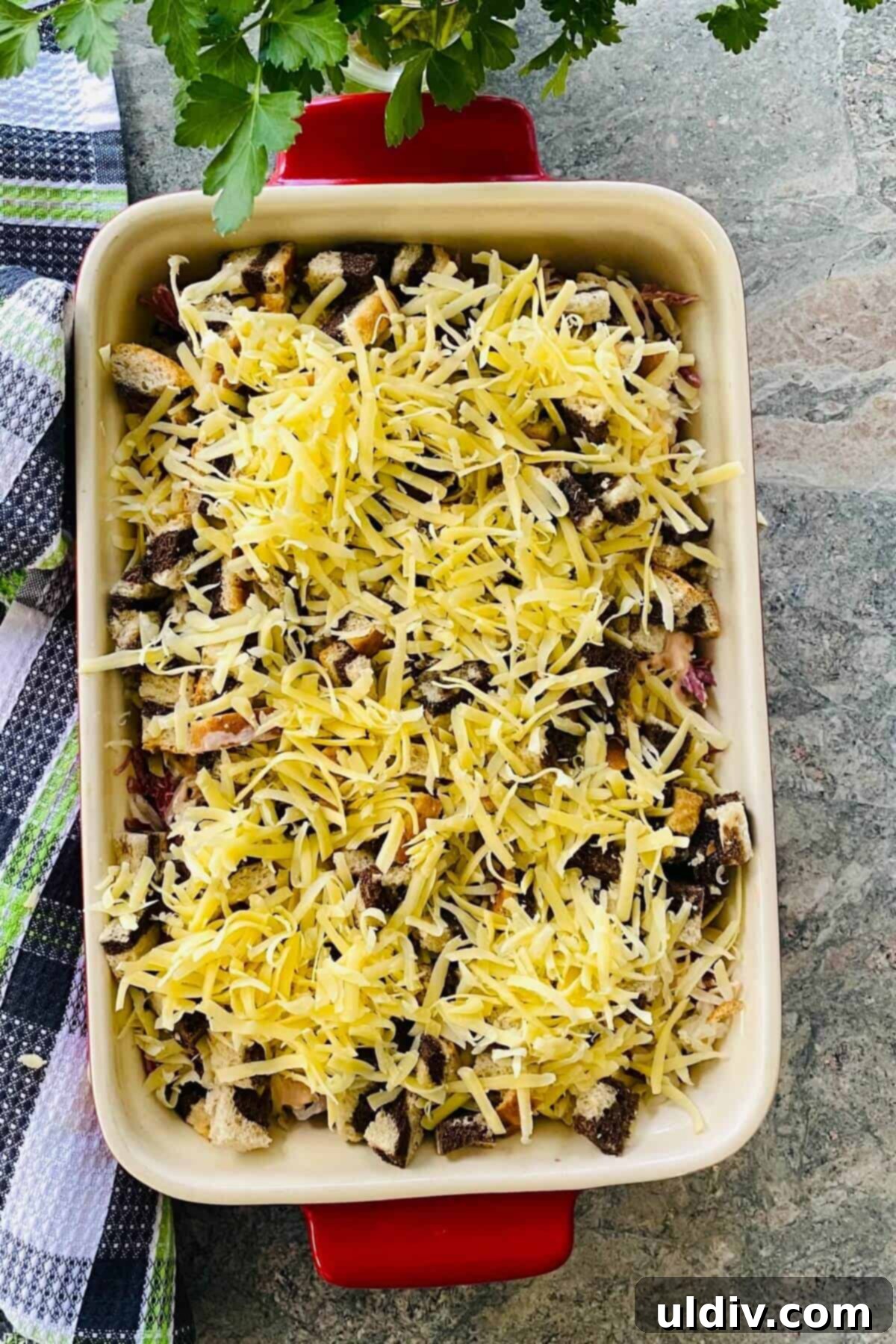 Easy and Delicious Reuben Casserole Recipe 8 The Reuben casserole assembled and ready for baking, topped with the final layer of Swiss cheese.