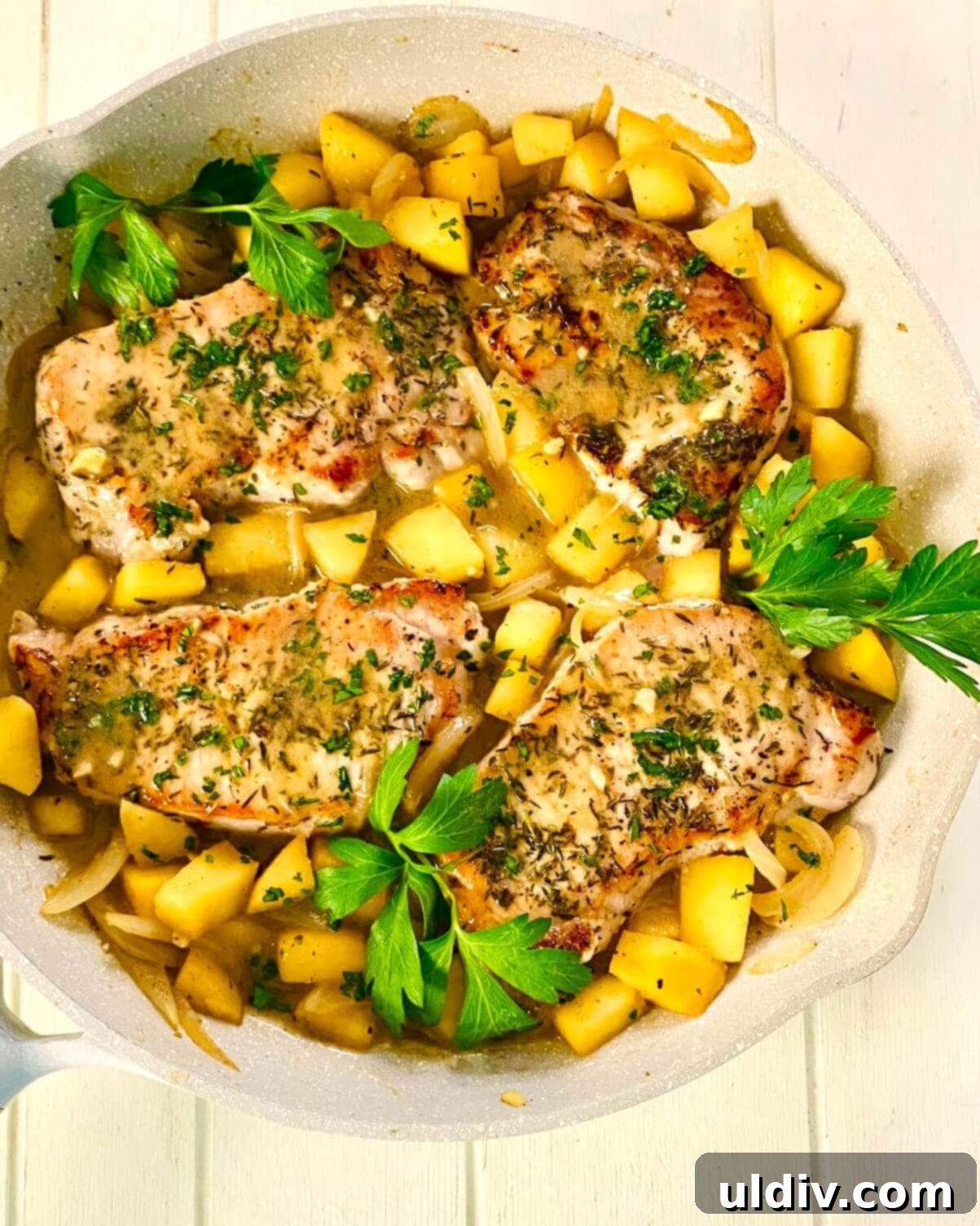 Sweet and Savory Apple Pork Chops 9 adding pork chops with apples and onions.