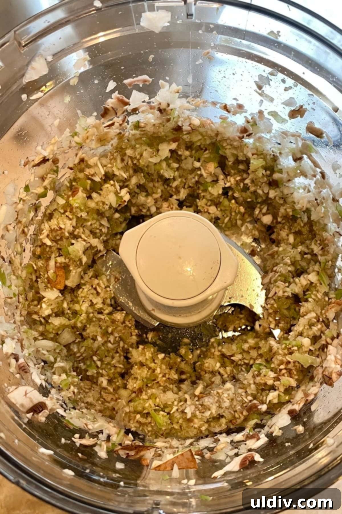 Comforting Turkey Meatloaf with Savory Mushrooms 5 Finely chopped vegetables – mushrooms, onion, celery, and garlic – processed in a food processor, ready to be mixed into the turkey meatloaf.