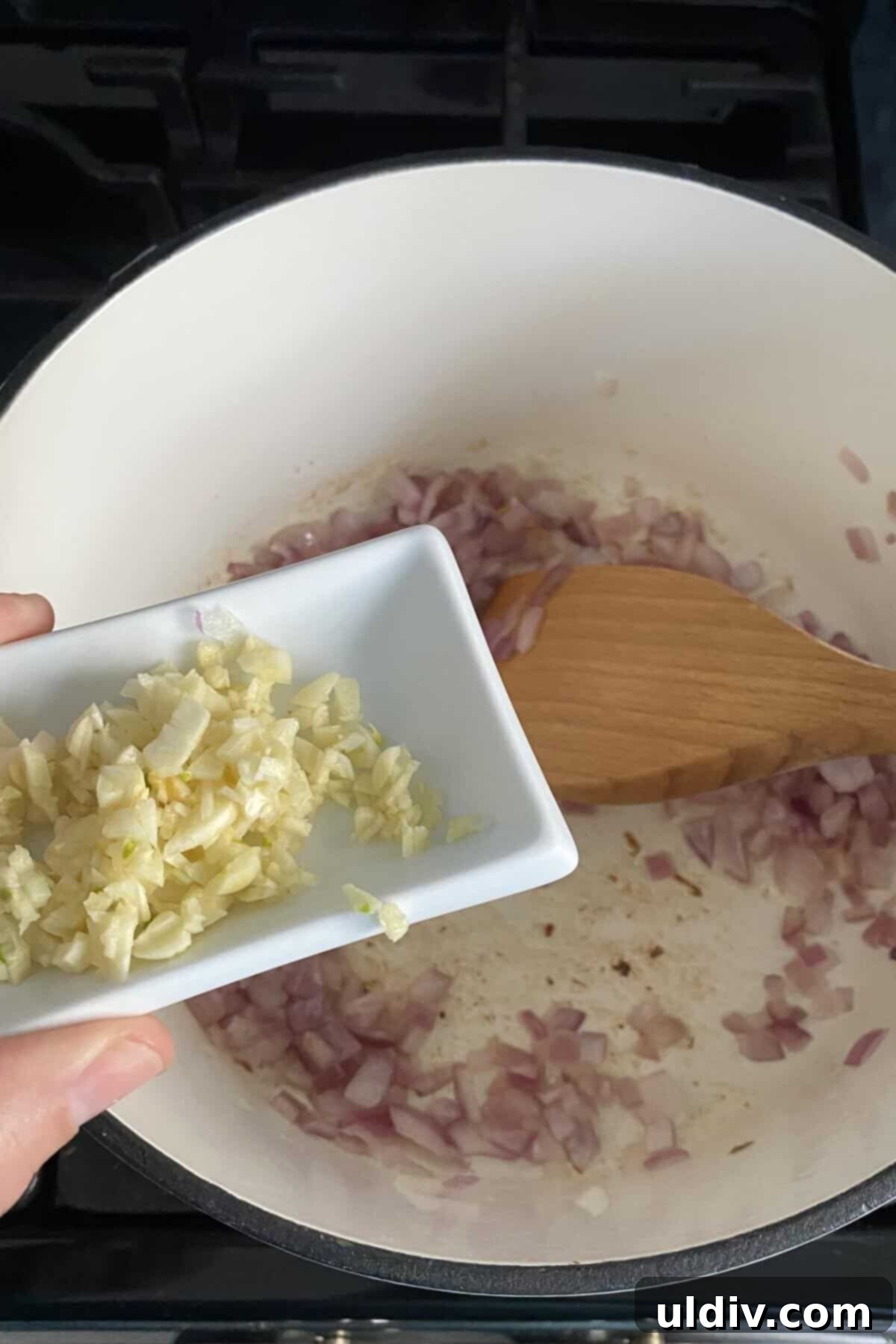 Tuscan Chicken Artichoke Soup 4 Sautéing diced red onions and minced garlic in olive oil until fragrant and translucent.