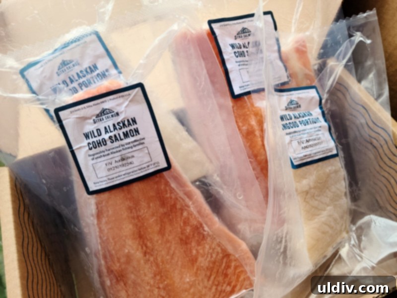 A box from Sitka Salmon Shares, showing a newsletter and recipe cards